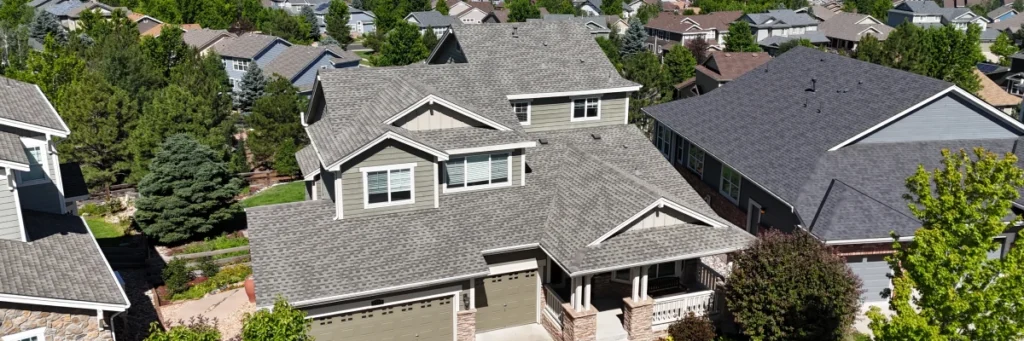Asphalt shingle roofs on modern suburban home, demonstrating best roofing shingle brands