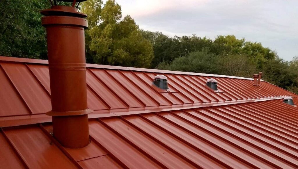 Red metal roof by Elite Roofing in Denver