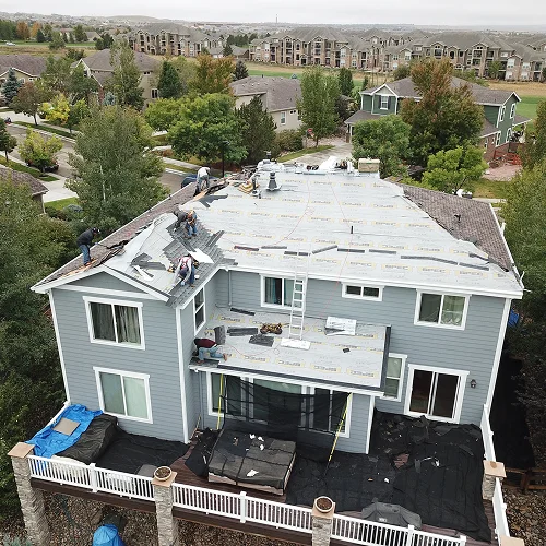 Roofing team preparing roof for winter with inspection and repair work by Elite Roofing & Solar in Denver