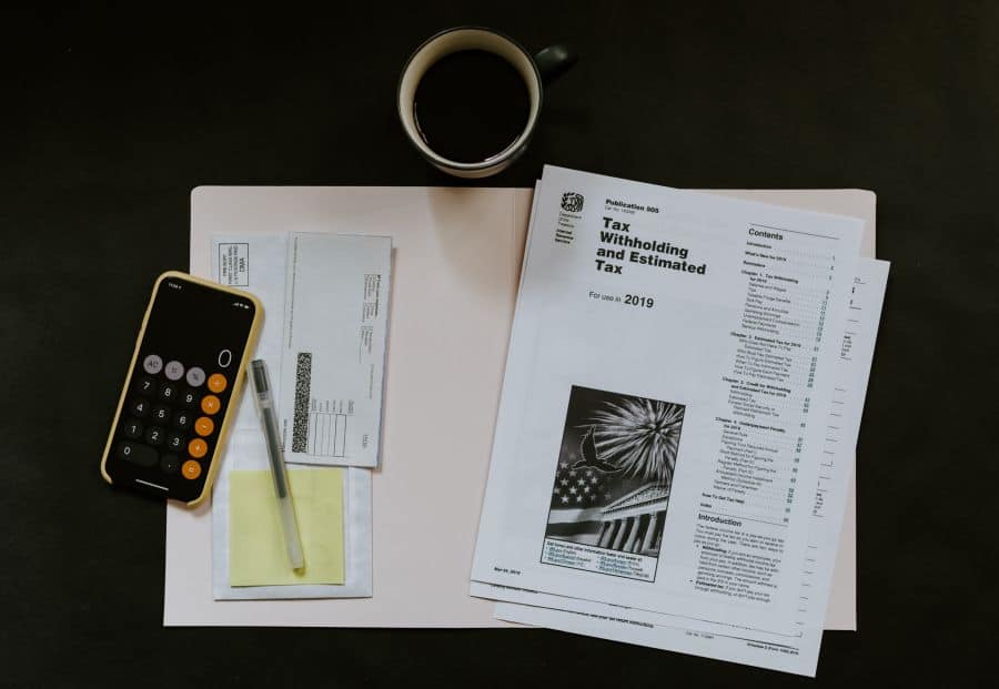 tax papers with a calculator