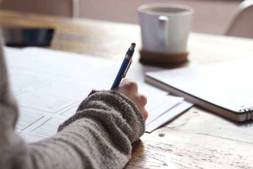 a homeowner writes on a roof replacement permit form