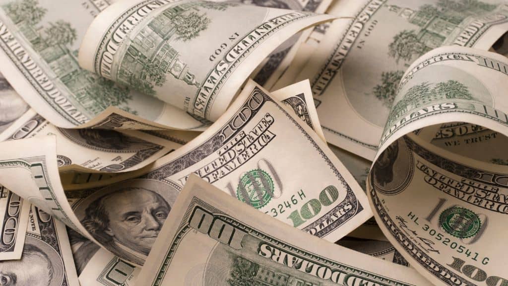 Pile of money for roof financing by Elite Roofing & Solar