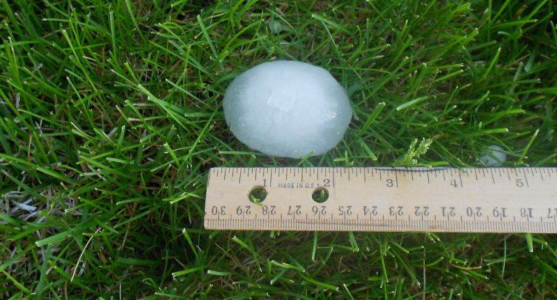 a hail stone measuring 2 inches that could damage a roof