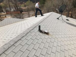 Elite Roofing & Solar staff having a roof inspection on top of a roof in Denver, CO