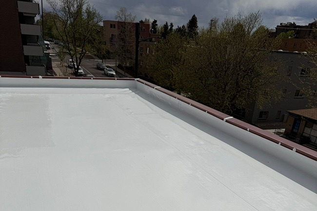 Freshly repaired commercial roof surface showing quality workmanship by Elite Roofing and Solar in Colorado