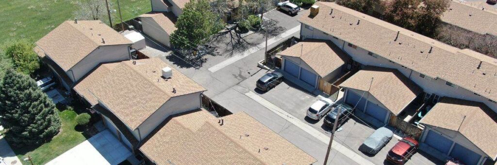 Aerial view of condo roofs with HO6 condo insurance coverage, Elite Roofing & Solar in Denver.
