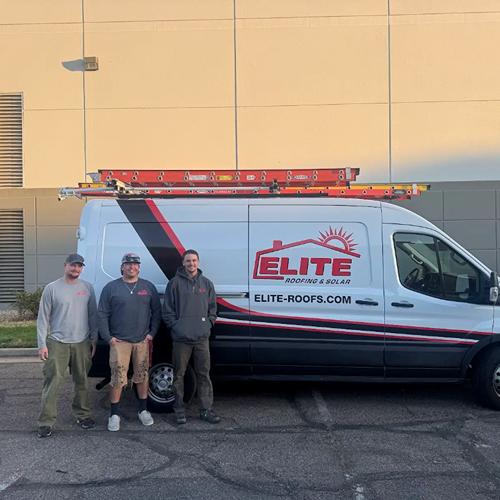 Solar installation team in Denver, Colorado, standing beside an Elite Roofing & Solar van, ready for a residential solar panel project.
