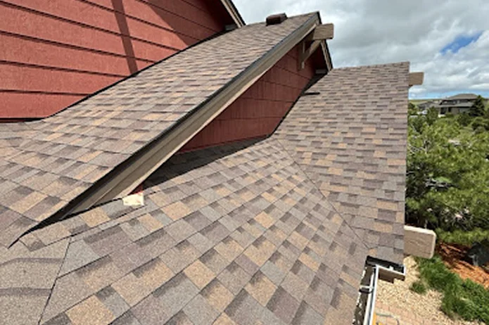 Newly installed asphalt shingles on a sloped roof by Elite Roofing and Solar in CO