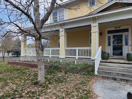 Yellow residential home showing potential for roof replacement and solar solutions by Elite Roofing and Solar in Denver, CO