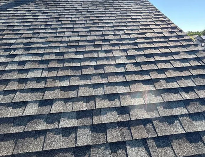 Close-up of high-quality asphalt shingles on a residential roof by Elite Roofing & Solar in Lone Tree, CO
