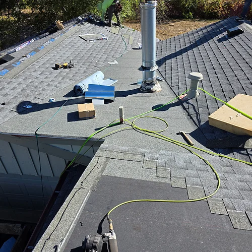 Rooftop installation and vent detailing during community roofing project Denver by Elite Roofing & Solar in Denver