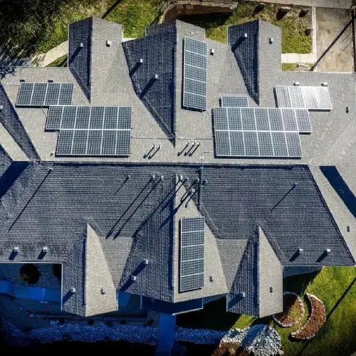 Aerial view of licensed solar installation on residential roof by Elite Roofing & Solar in Colorado