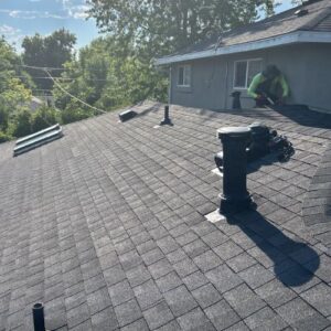 Gray asphalt shingle roof with three different types of roof vents, installed by Elite Roofing & Solar in Denver